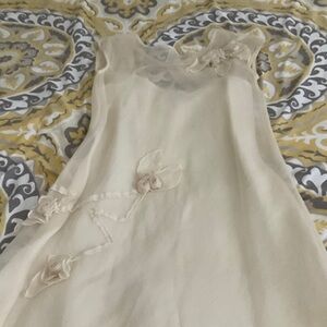 Elegant Cream Sleeveless Dress with Floral Accents